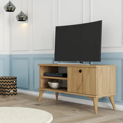 A TV stand with a TV on it, in a living room setting.