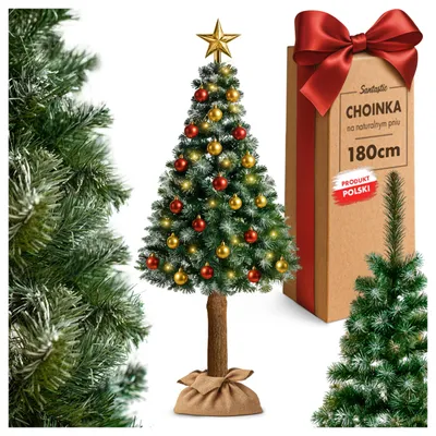 A decorated artificial Christmas tree with a brown trunk and a jute sack base, presented alongside its packaging box and a partial view of another Christmas tree.