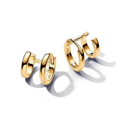A pair of gold hoop earrings on a white background.