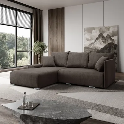 A sectional sofa is displayed in a modern living room with a large window offering a view of trees. A stone-effect coffee table with a water bottle and glass is in the foreground.