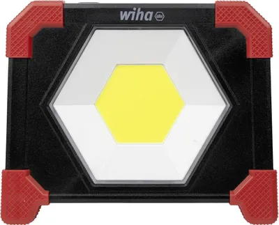 A black and red work light with a hexagonal white frame and a yellow LED light in the center.