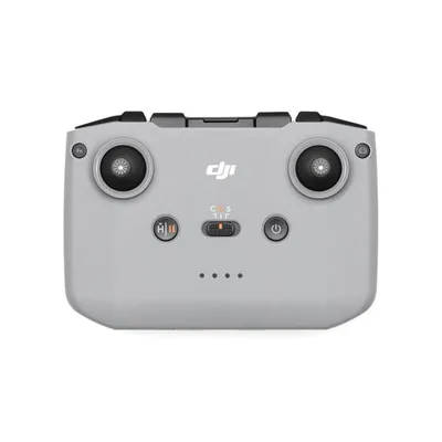 A top-down view of a gray drone remote control on a white background.
