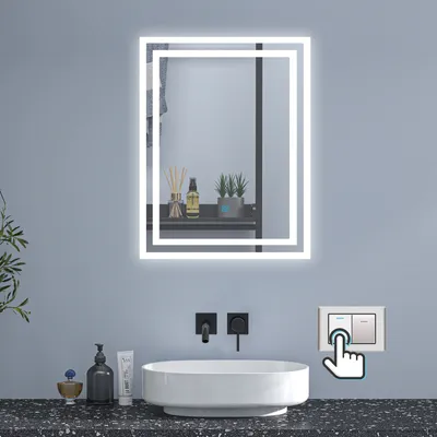 A bathroom vanity with a sink, mirror, and light switch.