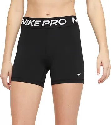 A person wearing black Nike Pro shorts.