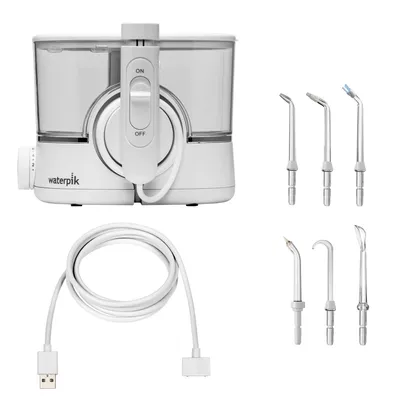 A white Waterpik WF-11 ION water flosser with multiple attachments and a charging cable.