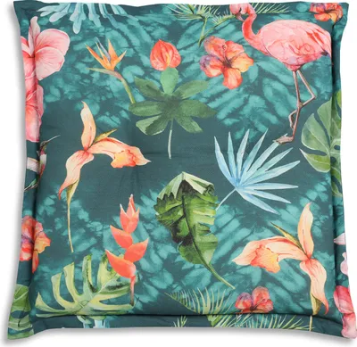 A close-up of a pillow with a tropical print.
