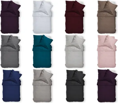 A grid of 12 different colored bedding sets, each with a duvet cover and pillowcase, arranged in four rows and three columns.