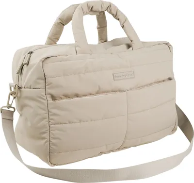 A quilted diaper bag in sand color is shown against a white background.