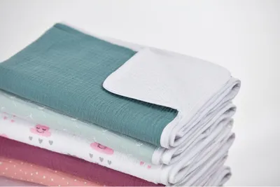 Produktbild von KraftKids Wickelunterlage Musselin nilblau 3 Lagen wasserundurchlässig weich Frotte 100% Baumwolle
