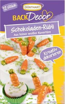 A package of chocolate carrot decorations for baking, shown with some of the decorations on a cake and cupcake.