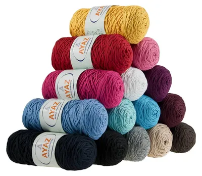 A pyramid of colorful yarn balls stacked on a white background.