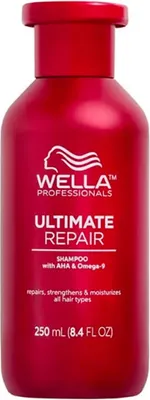 A red bottle of Wella Professionals Ultimate Repair Shampoo.