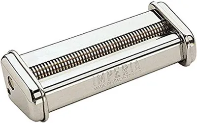 A close-up, angled view of a metal pasta maker attachment.