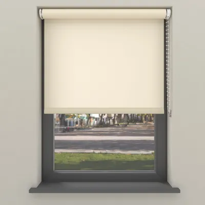 A cream-colored roller blind is shown covering most of a window, with a view of a street and grass visible through the lower part of the window.