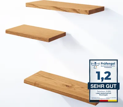 Three wooden shelves mounted on a white wall, with a certification badge in the lower right corner.
