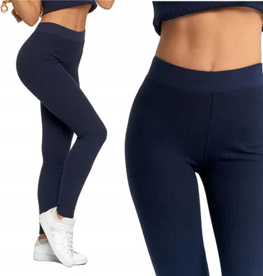A woman wearing navy blue ribbed leggings and a matching top, shown from the side and a close-up of the waist and hips.