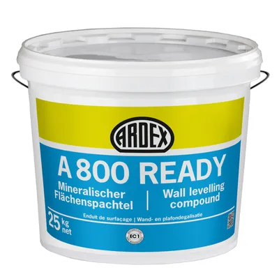 A white plastic bucket with a yellow and blue label.