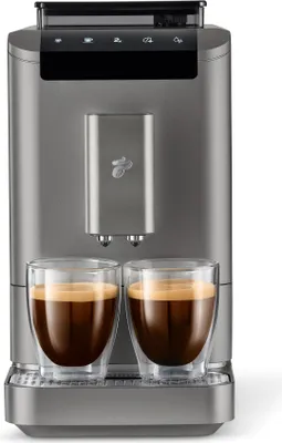 A Tchibo coffee machine with two cups of coffee.