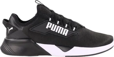A black Puma athletic shoe with a white sole, shown from the side against a white background.
