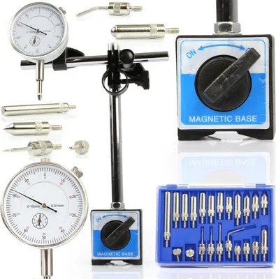 A collection of precision measuring tools, including a dial indicator, magnetic base, and various probes, displayed against a white background.
