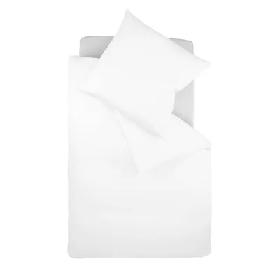 A top-down view of white bedding on a bed.