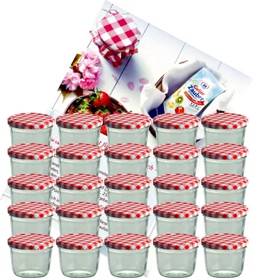 A collection of small glass jars with red and white checkered lids, arranged in rows, with some decorative elements like flowers and a packet of gelling agent in the background.