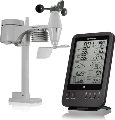 A white weather station and a black weather display are shown against a white background.