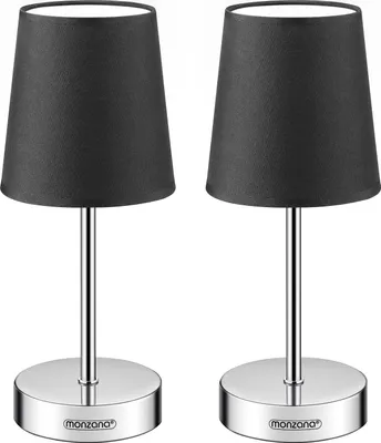 Two identical table lamps with black fabric shades and silver bases are shown against a white background.