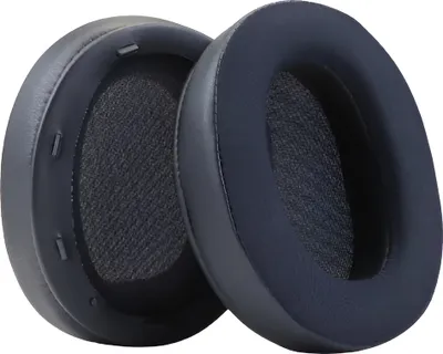 Two dark blue headphone ear pads are shown against a white background.