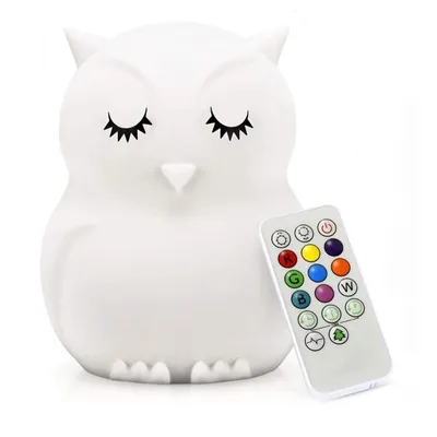 A white owl-shaped night light with a remote control.