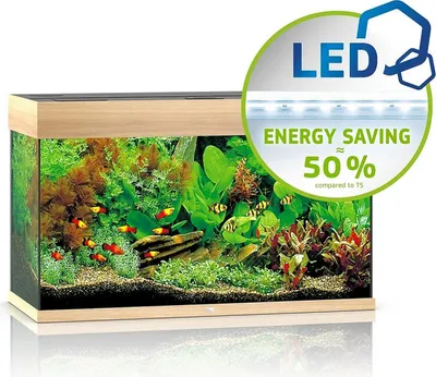 A well-lit aquarium with fish and plants, featuring a marketing overlay highlighting LED lighting and energy savings.