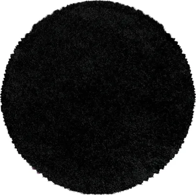 A round, black, high-pile rug is shown against a white background.