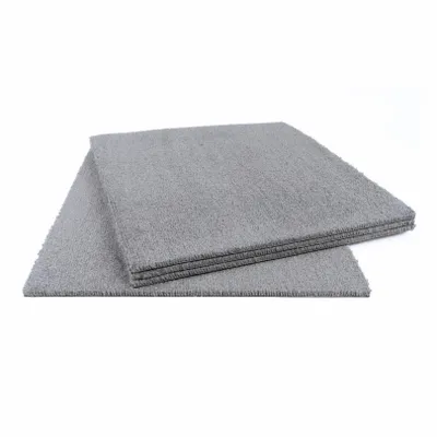 A stack of grey carpet tiles on a white background.