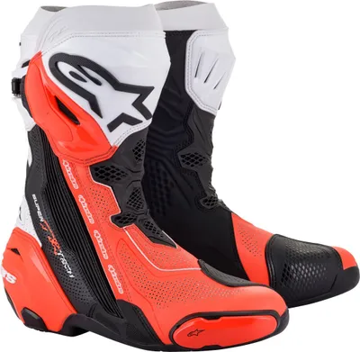 A pair of red, black, and white motorcycle boots.