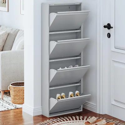 A narrow, multi-tiered shoe cabinet with open flip-down doors is shown in a hallway next to a door.