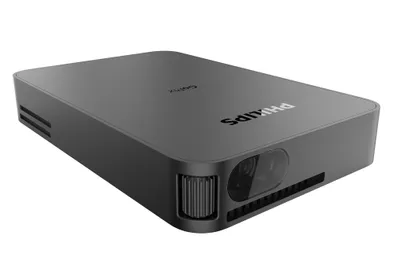 A dark gray Philips GoPix projector is shown from a diagonal angle on a white background.