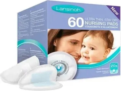 A product box for Lansinoh nursing pads, with a mother and baby pictured on the front, and some pads shown in front of the box.