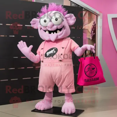 Productafbeelding van Roze Frankenstein mascotte REDBROKOLY kostuum karakter gekleed met een rompertje en draagtassen