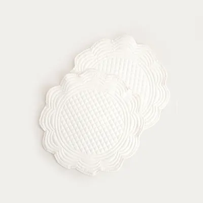 Zdjęcie produktu dla Podkładki pod talerze HOMLA ALVEN w kolorze ecru, okrągłe, z pikowaniem, zestaw 2 szt. 38 cm