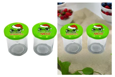 Two jars with green lids featuring a cartoon character wearing a Santa hat and text, placed on a white background on the left and on a textured fabric background on the right.
