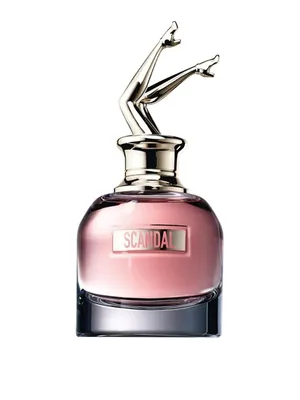 A perfume bottle with a unique stopper shaped like legs in high heels.