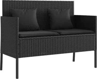 A black poly rattan garden bench with black cushions and pillows, shown from the front.