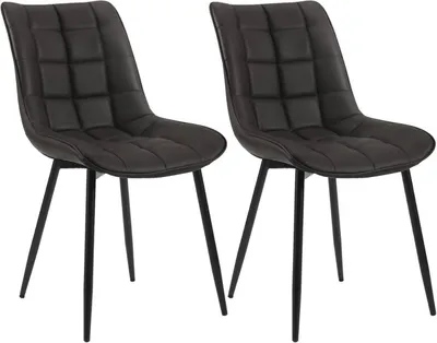 Two dark grey upholstered dining chairs with black metal legs are shown against a white background.