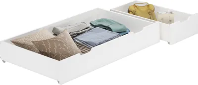 Two open white drawers filled with folded clothes and pillows.