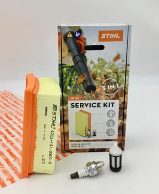 A Stihl service kit for leaf blowers and sprayers, including an air filter, spark plug, and fuel filter, displayed with its packaging.