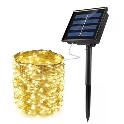 A solar-powered LED string light set with the lights coiled and the solar panel unit standing upright.