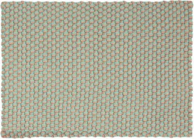A close-up view of a woven rug with a repeating pattern.