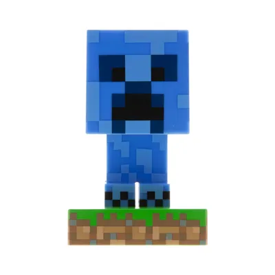 A blue Minecraft Creeper figurine standing on a grass and dirt block base.