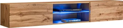 A wooden TV stand with open compartments and blue LED lighting.