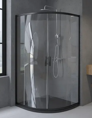 A modern bathroom with a black framed glass shower enclosure.
